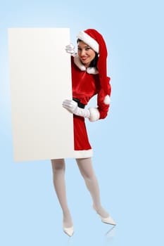 Portrait of a santa girl with a blank banner