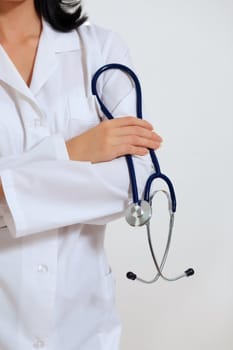 Portrait of happy successful young female doctor holding a stethoscope