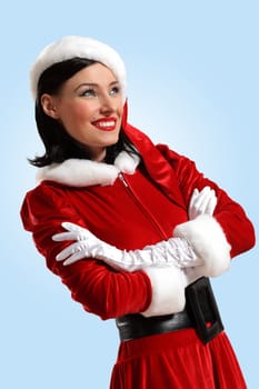 Portrait of beautiful young woman wearing santa claus clothes