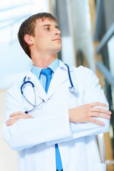 Portrait of friendly male doctor in hospital smiling