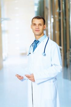 Portrait of friendly male doctor in hospital smiling