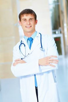 Portrait of friendly male doctor in hospital smiling