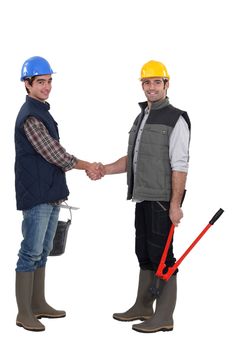 Construction workers handshaking