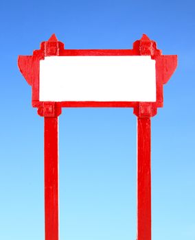 red blank wooden sign with blue sky