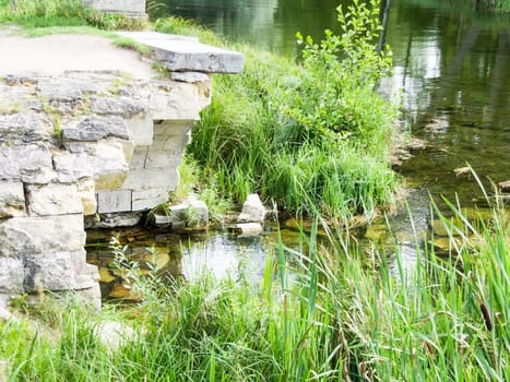 ruins on the lake in the park