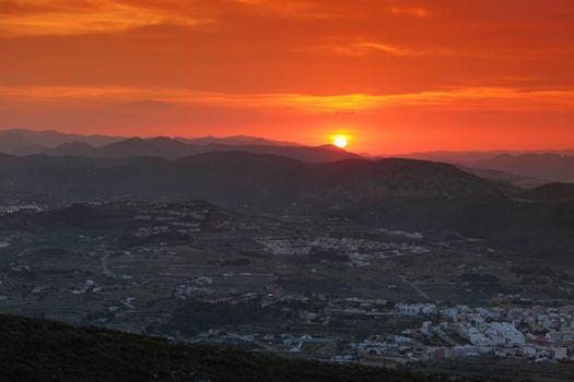 Summer landscape in mountains with the sun