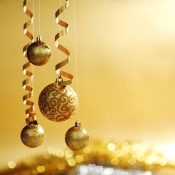 golden christmas balls on bokeh background