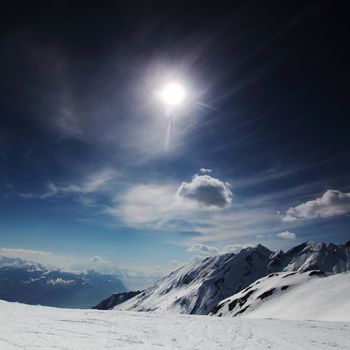 top of mountains in blue sky