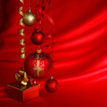  christmas balls on red satin background