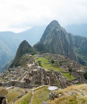 Morning views of Machu Picchu as mist clears from the mountainside