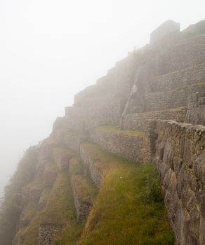 Morning views of Machu Picchu as mist clears from the terraces