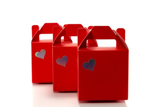 three red gift boxes isolated on white