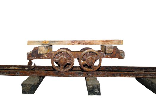 old rusty wagon on a salt mine isolated over white background