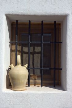 Spanish typical jar in window (vertical) in Mijas Town (Almeria - ESPA�A)