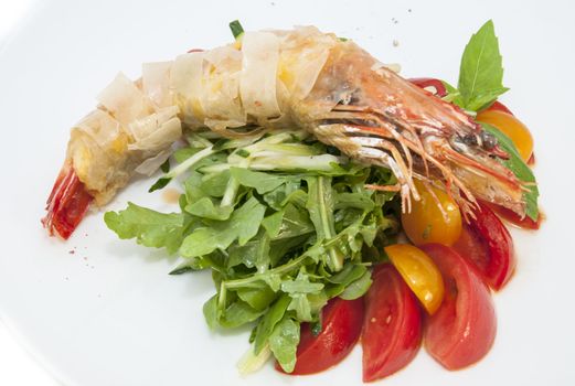 jumbo shrimp with herbs and several types of tomatoes