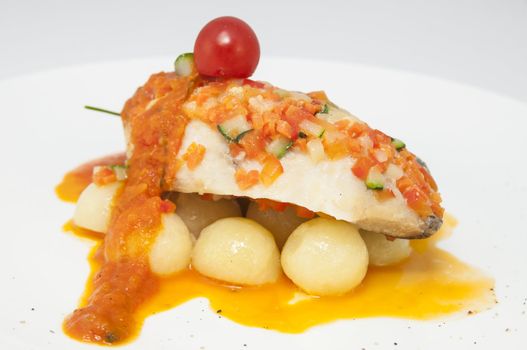 baked fish with potatoes in tomato sauce