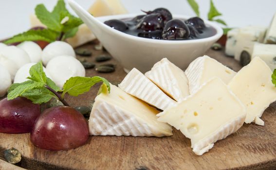 cheese plate with several varieties of cheese in the restaurant