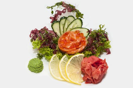 Japanese cuisine sashimi with vegetables and fish in a restaurant