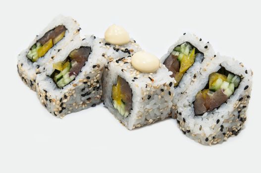 Japanese rolls in a restaurant with fish and vegetables