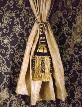 great design of fabric and tassel on the fabric background 