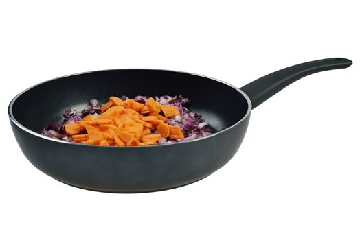 Onions and carrots in a frying pan. Isolated on white.