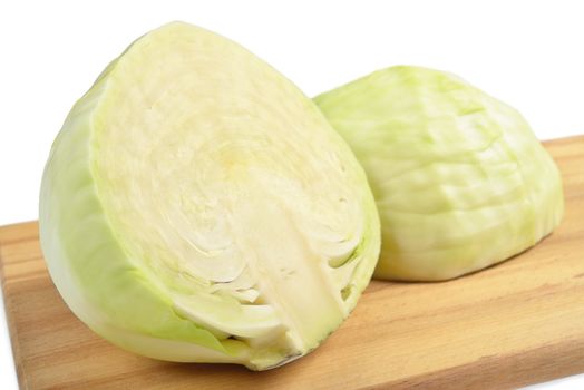 Cabbage on a cutting board. Isolated on white.