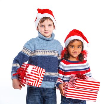 Smiling little mullato girl and her brother in Santa's hat with gift box, isolated on white