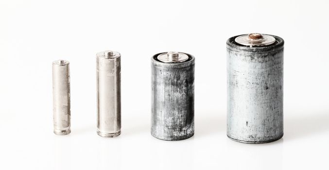 Old batteries isolated on white background