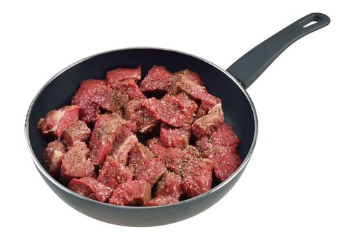 Raw meat in a frying pan. Isolated on white.