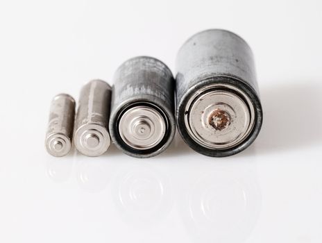 Old batteries isolated on white background