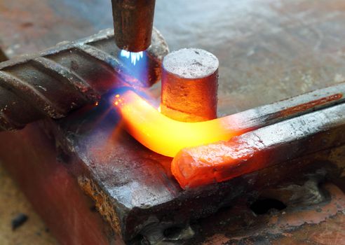 Gas heating cutting metal using torch and bending square bar