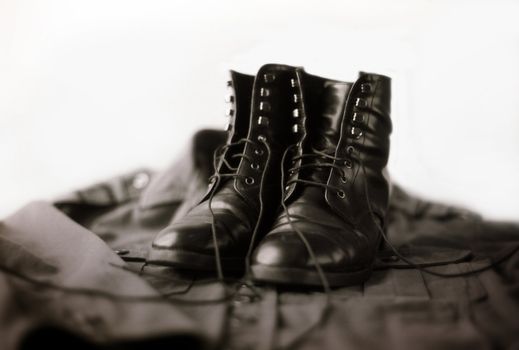 Leather Black Army Boots on a Military Vest