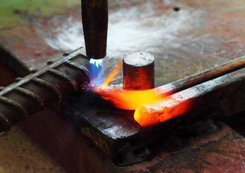 Gas heating cutting metal using torch and bending square bar