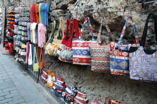 Colorful turkish bags and traditional souvenirs in oriental bazaar in Antalya, Turkey