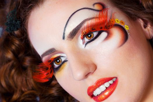 a close up portrait of a pretty redhead girl with professional makeup