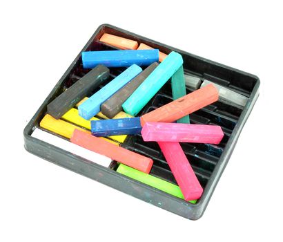 Multicolored artist's pastels (chalk) on white background