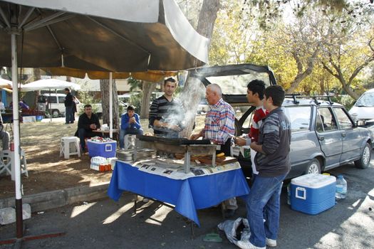 Street food vendor and the buyer at the sunday market in Antalya, Turkey