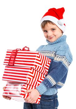 Christmas theme - Smiling little boy in Santa's hat with gift box, isolated on white