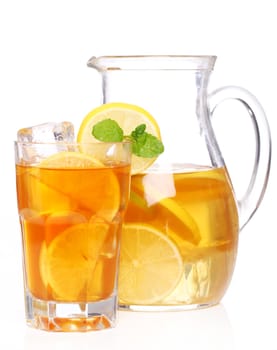 Fresh and cold ice tea with sliced lemon and mint