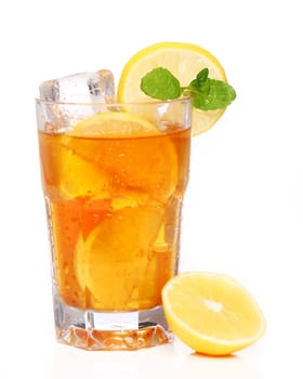 Fresh and cold ice tea with sliced lemon and mint