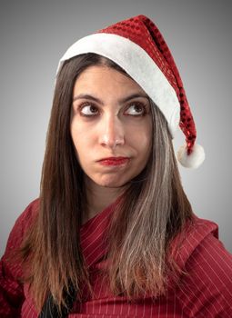 doubtfull business christmas girl on grey background