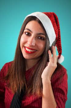 smiling business christmas girl at the phone on blue background