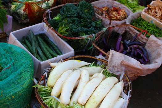 Fresh vegetables in baskets in a Chinese market