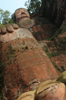 Leshan Giant Buddha, view from above. It is the largest stone Buddha in the world and it is by far the tallest pre-modern statue in the world. Leshan Giant Buddha Scenic Area has been listed as a UNESCO World Heritage Site since 1996.
