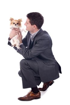 young business man and chihuahua in front of white background
