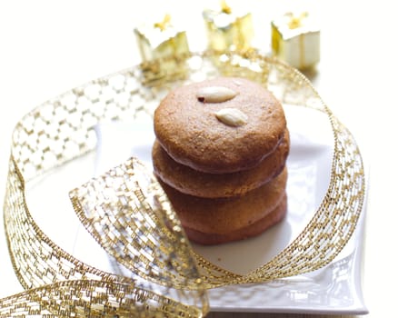 Cookies with nuts on the background of Christmas gifts