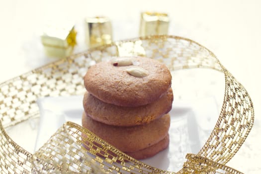 Cookies with nuts on the background of Christmas gifts