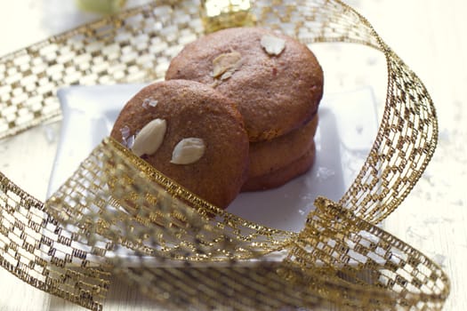 Cookies with nuts on the background of Christmas gifts