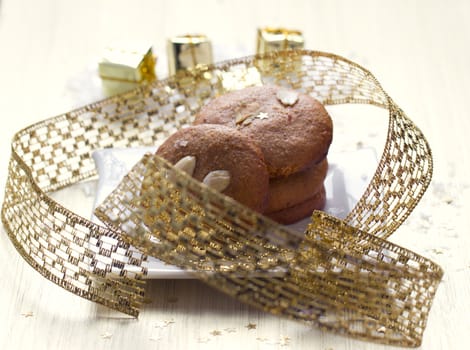 Cookies with nuts on the background of Christmas gifts