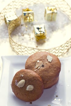 Cookies with nuts on the background of Christmas gifts